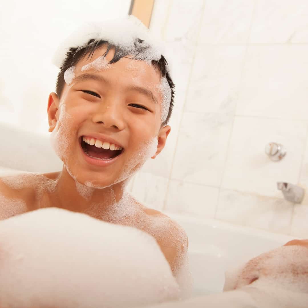 child taking epsom salt bath for constipation