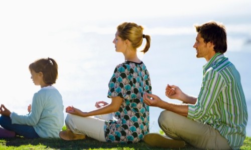 Family meditating together