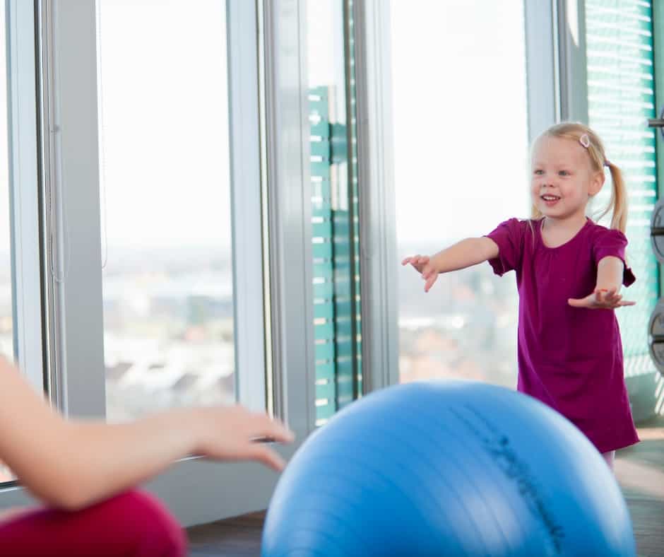 Little girl with therapy ball