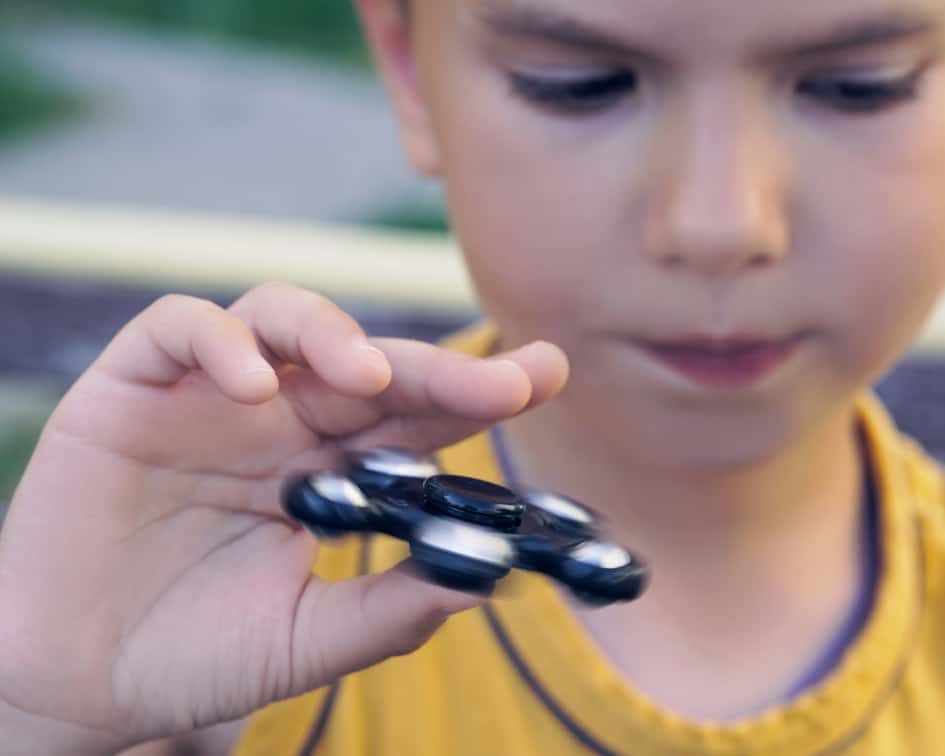 Child holding fidget spinner